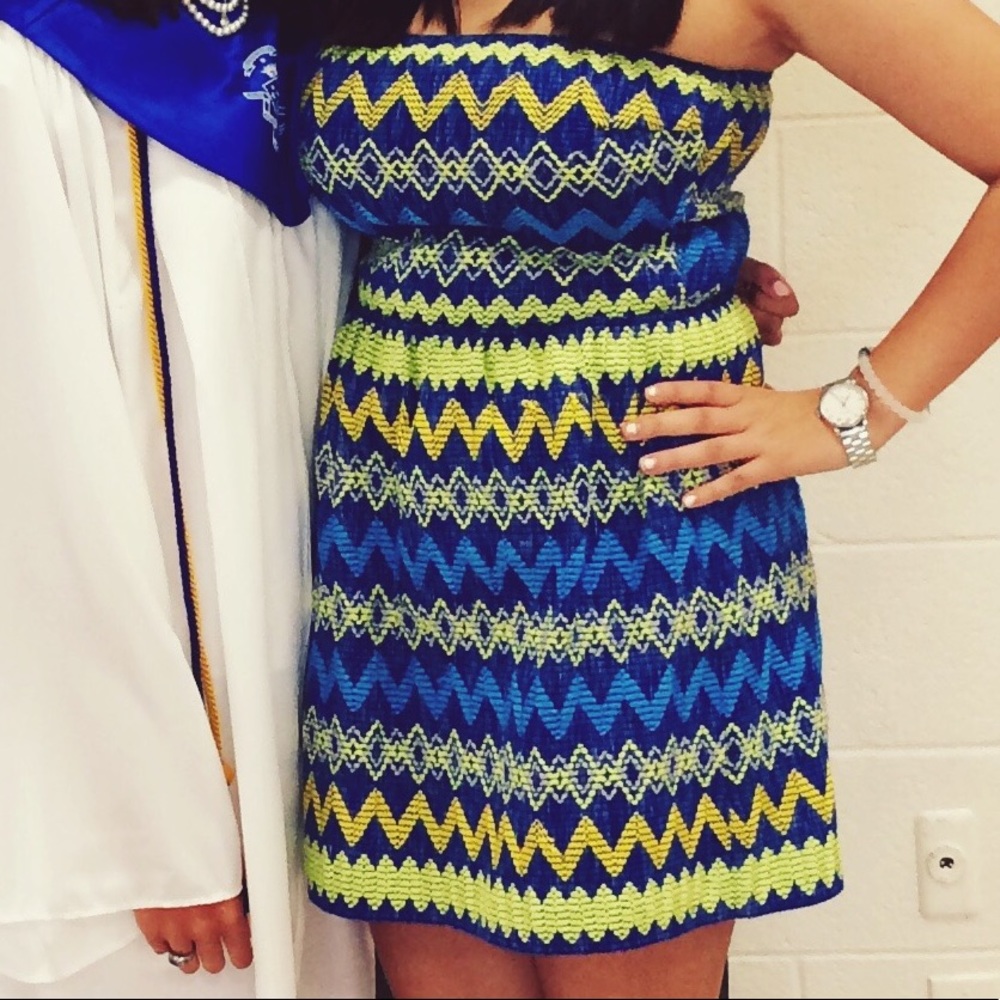 Blue dress with yellow and green stitching